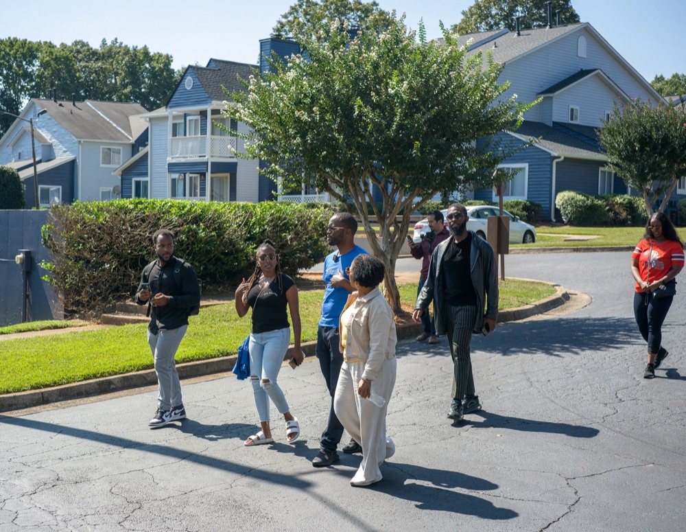 Members touring a multifamily property