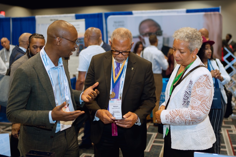 Members meeting industry experts at a conference
